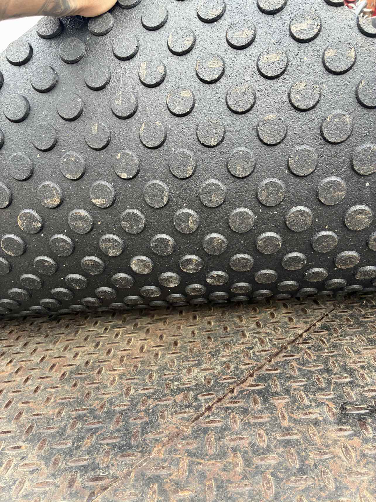 Close-up of rubber mat texture showing anti-slip surface